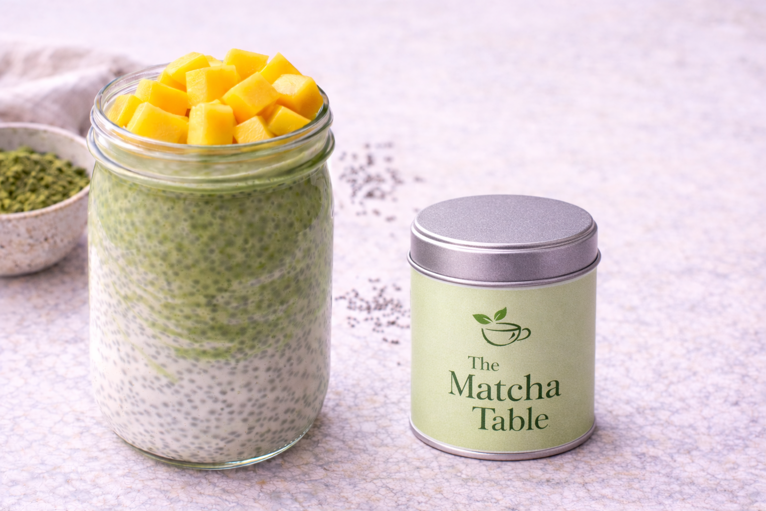 Matcha chia pudding in a clear mason jar with peeled kiwi slices on top